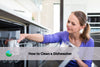 unloading dishwasher to prepare to clean the dishwasher
