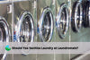 laundry machines next to each other at a laundromat