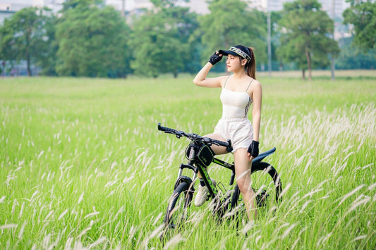 woman with activewear on bike